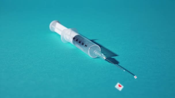Syringe expels little hearts with written like - Video, Çekim