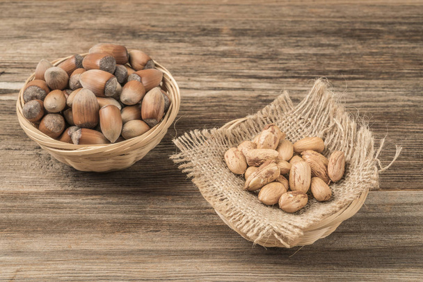 fresh hazelnuts on a wooden table with copy space - Zdjęcie, obraz