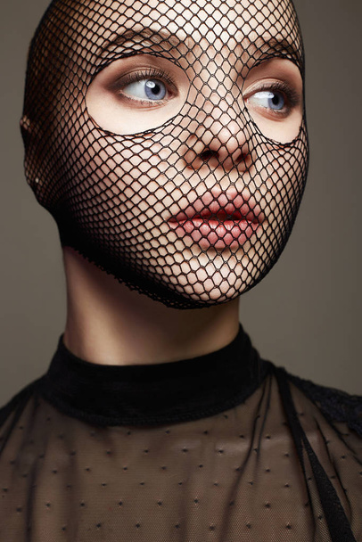 Beautiful Woman in Net on her Face. Sexy Girl in mask - Photo, Image