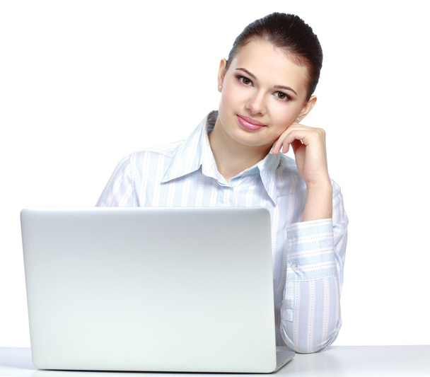 Woman sitting in front of a laptop - Photo, Image