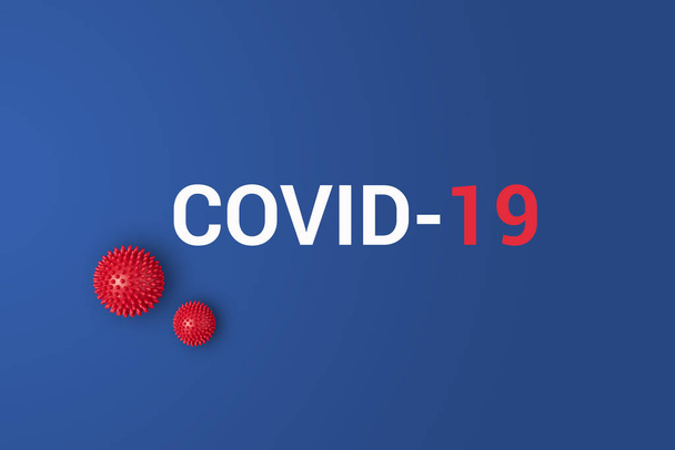 Mavi zemin üzerinde kırmızı top ile Covid-19 yazıları - Fotoğraf, Görsel