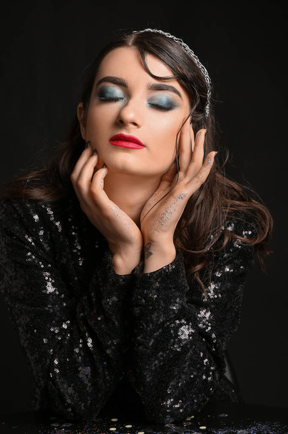 Beautiful fashionable woman on dark background - Fotografie, Obrázek