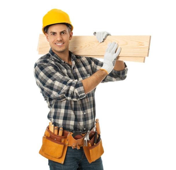 Handsome carpenter with wooden planks isolated on white - Фото, зображення