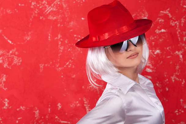 Woman in red hat - Фото, изображение