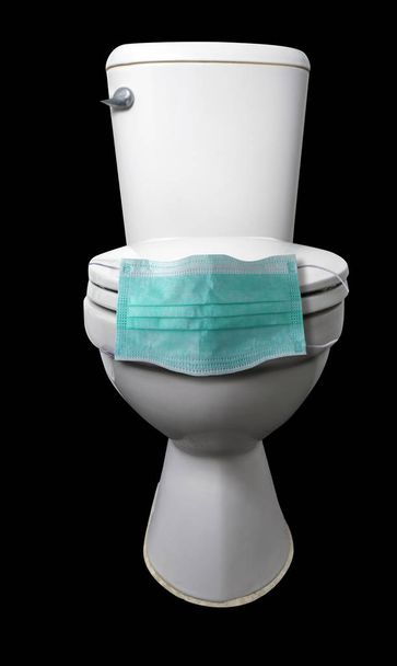 Toilet bowl on Black With Protective face mask. - Photo, image