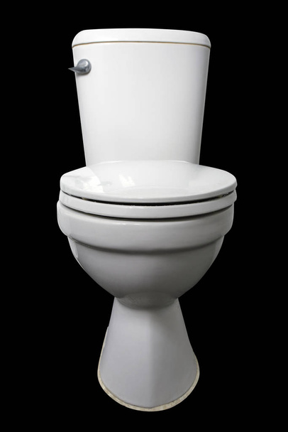 White toilet bowl isolated on black background. - Photo, image