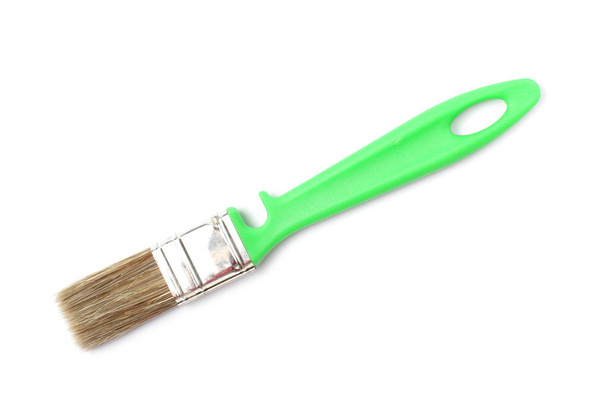 Paint brush with a green handle close-up on a white background. - Fotoğraf, Görsel
