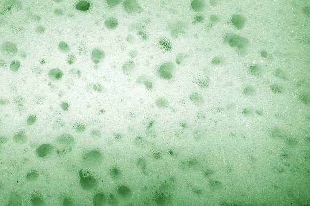 Nettoyage de la surface de l'éponge de près en couleur verte
. - Photo, image