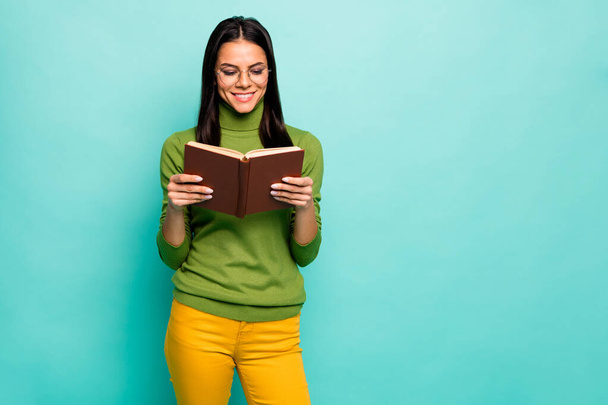Portrait of her she nice attractive lovely focused intellectual cheerful cheery girl reading interesting scientific work isolated on bright vivid shine vibrant blue green turquoise color background - Photo, image