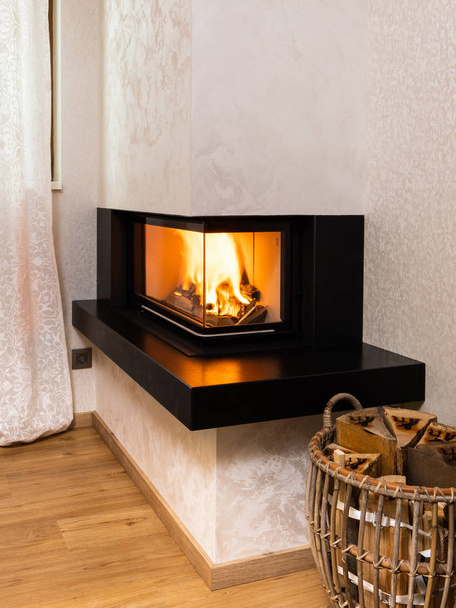 modern, minimalist fireplace in the corner of the room - Φωτογραφία, εικόνα