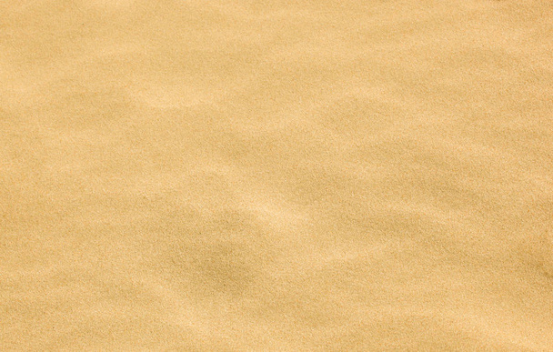 Primer plano de la textura de fondo de arena. - Foto, imagen