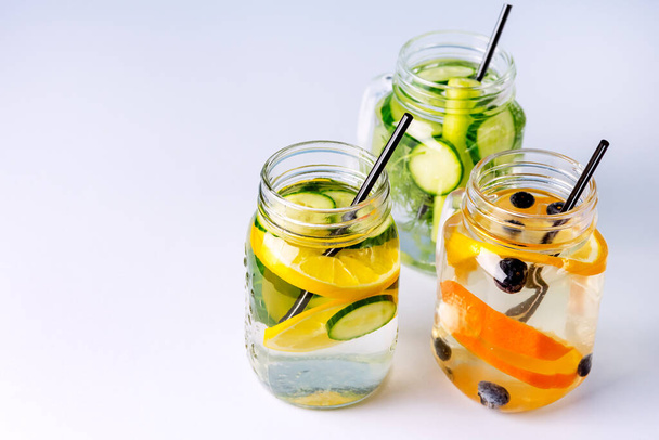 Glass Jars with Fresh Infused Water Made With Organic Fruits and Vegetables Healthy Detox Drink Copy Space - Фото, изображение