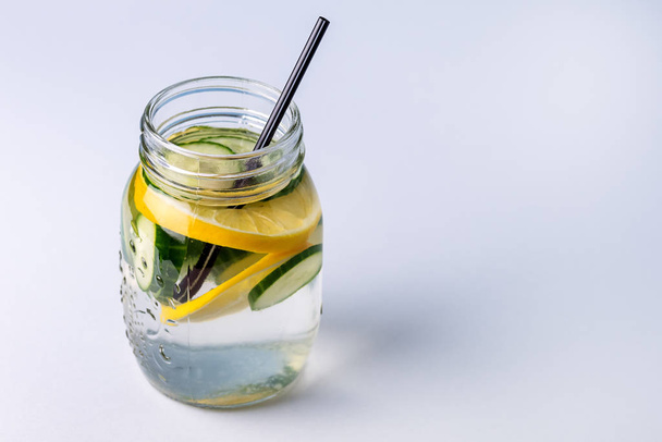 Glass Jars with Fresh Infused Water Made With Organic Fruits and Vegetables Cucumber and Lemon Healthy Detox Drink Copy Space - Fotografie, Obrázek