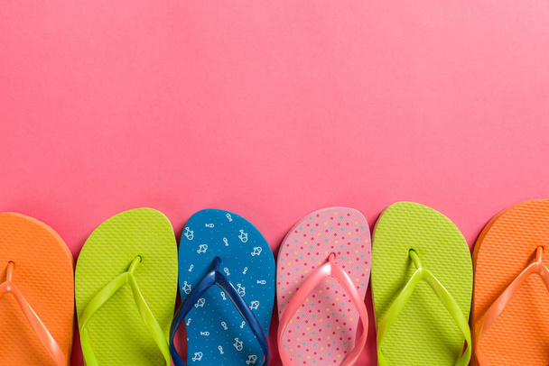 a lot of flip flop colored sandals, summer vacation on colored b - Photo, Image