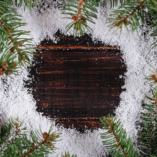 Christmas background frame, green Christmas trees on a wooden ta - Fotoğraf, Görsel