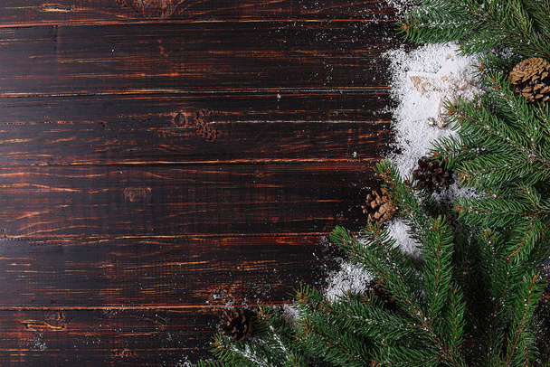 Christmas background, Fir-trees and cones on a wooden table, cru - Fotoğraf, Görsel