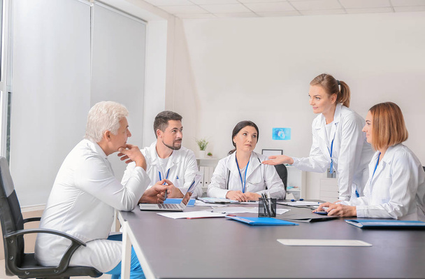 Team of doctors during meeting in clinic - Фото, изображение