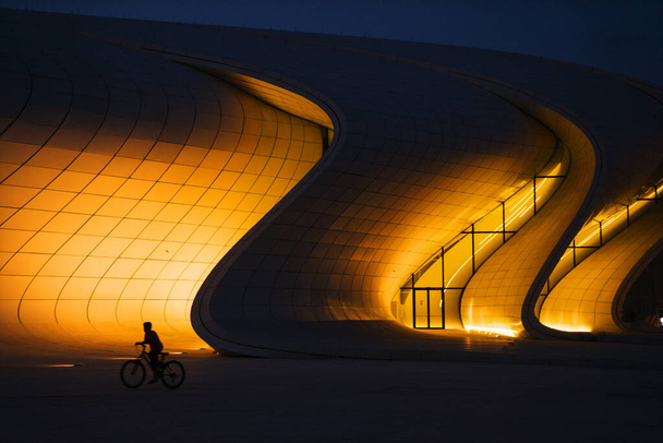 BAKU, AZERBAIJAN - SEPTEMBER 12, 2016: The Heydar Aliyev Center at night. It is a building complex in Baku in Azerbaijan, noted for its distinctive architecture and flowing, curved style - Photo, Image