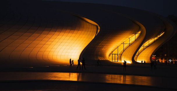 BAKU, AZERBAIJAN - SEPTEMBER 12, 2016: The Heydar Aliyev Center at night. It is a building complex in Baku in Azerbaijan, noted for its distinctive architecture and flowing, curved style - Photo, Image