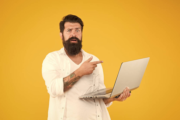 what is that. agile business concept. education in digital world. Programmer with computer. brutal man surfing internet. hipster use notebook. Bearded man laptop yellow background. shopping online - Fotó, kép