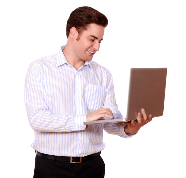 Attractive redhead man working on his laptop - Zdjęcie, obraz