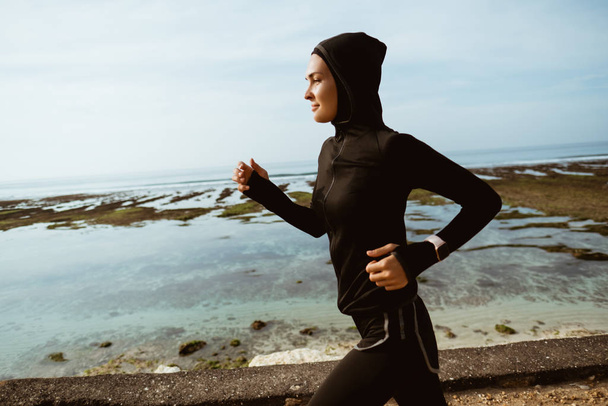 muslim sport runner woman outdoor - Fotó, kép