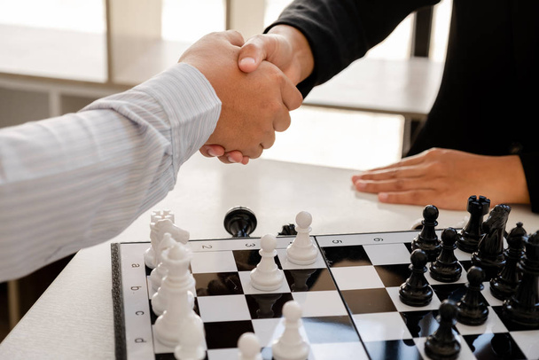 Businessmen shake hands after the competition, showing leadership, followers and business success strategies - Photo, Image