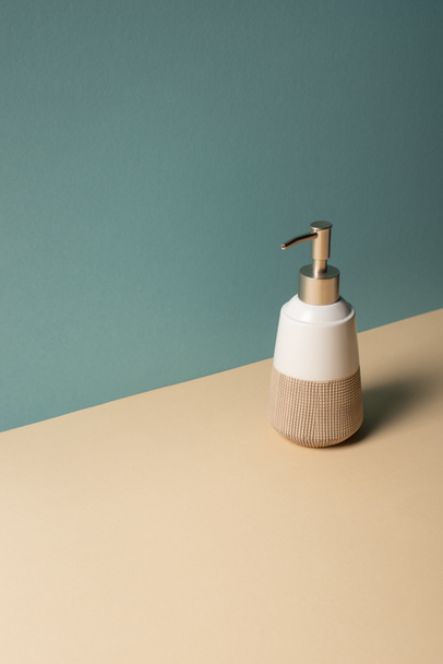 Liquid soap dispenser on beige and grey, zero waste concept - Фото, зображення