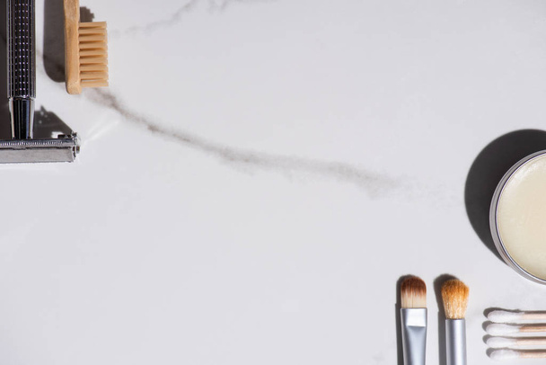 Top view of cosmetic brushes, toothbrush, razor, jar of wax and ear sticks on white background, zero waste concept - Fotó, kép