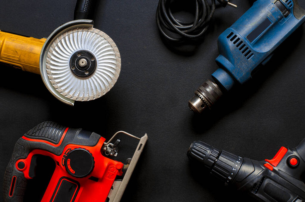 Construction worker tools on a dark background top view. - Foto, Imagem
