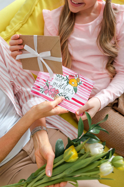 cropped view of kid giving presents to mom on mothers day  - Photo, Image