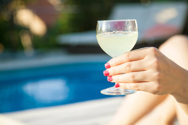 Summer day lifestyle woman relax near luxury swimming pool.  - Foto, Bild