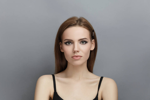 Young girl with brown hair studio photo - Photo, Image