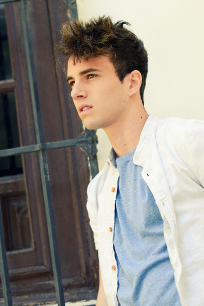 Attractive young man in urban background - Photo, Image