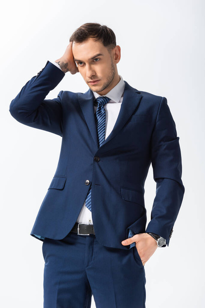 successful tattooed young businessman in blue suit posing isolated on white - Fotografie, Obrázek