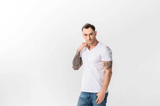 handsome young tattooed man posing isolated on white - Foto, afbeelding