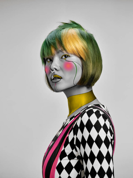 Young woman with fashionable look, stylish make-up and hairstyle, lines design - 写真・画像
