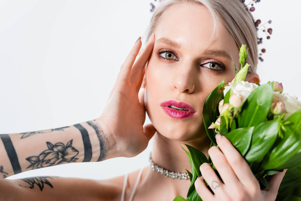 portrait of beautiful tattooed bride posing with floral bouquet isolated on white - Φωτογραφία, εικόνα