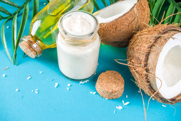 Coconut oil with fresh coconuts - Photo, Image