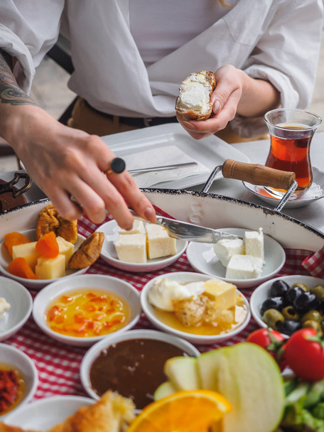 Classic turkish breakfast with different types of cheese. Butter on bread - Fotó, kép
