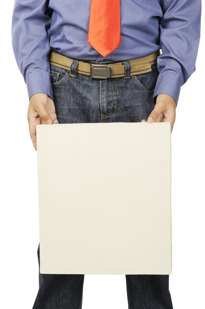 Male hand holds a square canvas - Foto, Bild