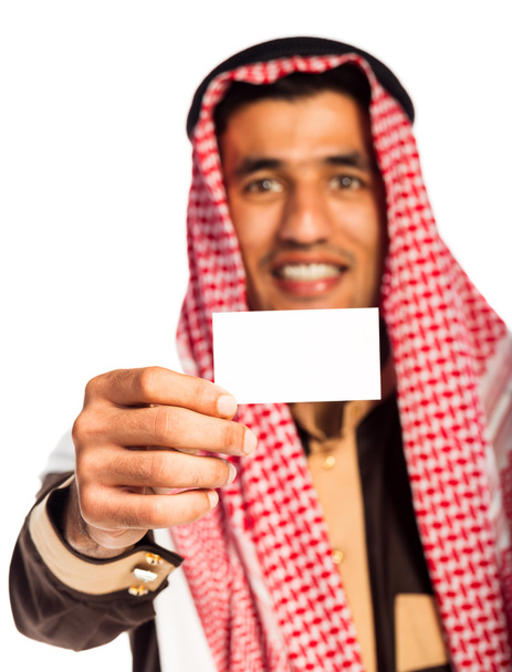 Young smiling arab showing business card in hand isolated on whi - Foto, Imagen