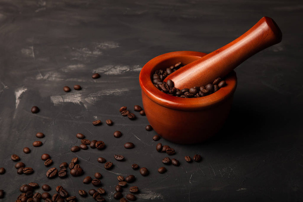 Composition with a coffee beans on a textured plastered backgrou - Photo, image