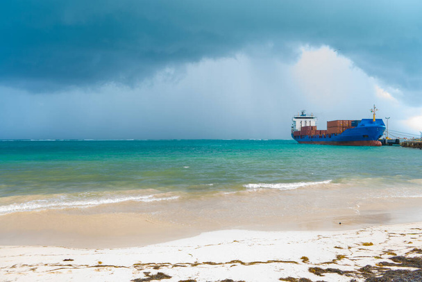 Caribbean sea before a storm. View with clouds and ship. Turquoise sea and dark sky. Background or wallpaper. Travel photo. Puerto Morelos. Quintana roo. Yucatan. Mexico. - Photo, Image