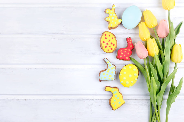 Easter gingerbread rabbits cookies, tulips and eggs  - Фото, зображення
