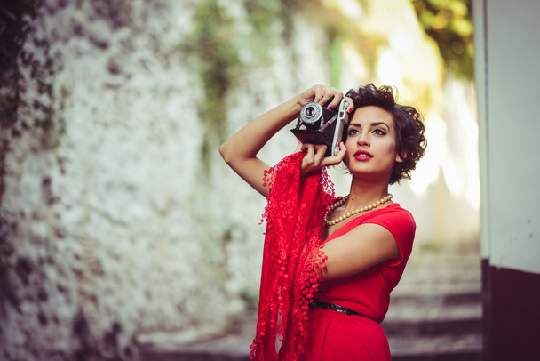 Beautiful woman in urban background. Vintage style - Photo, Image