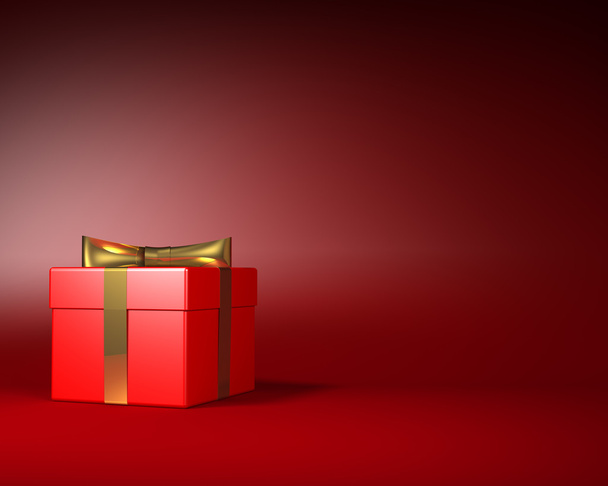 Red Gift Box with Gold Ribbon and Bow on the Red Background - Foto, Imagen