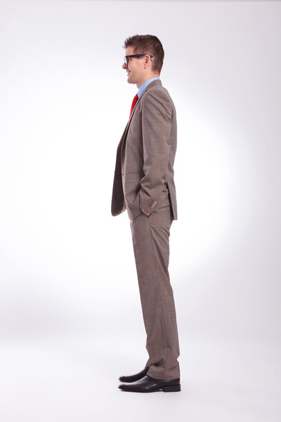 side of young business man with hands in pockets - Photo, image