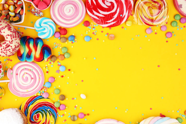 candies with jelly and sugar and streamers. colorful array of di - Photo, Image
