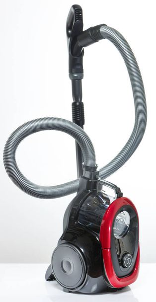Black and red vacuum cleaner on a white background - Photo, Image